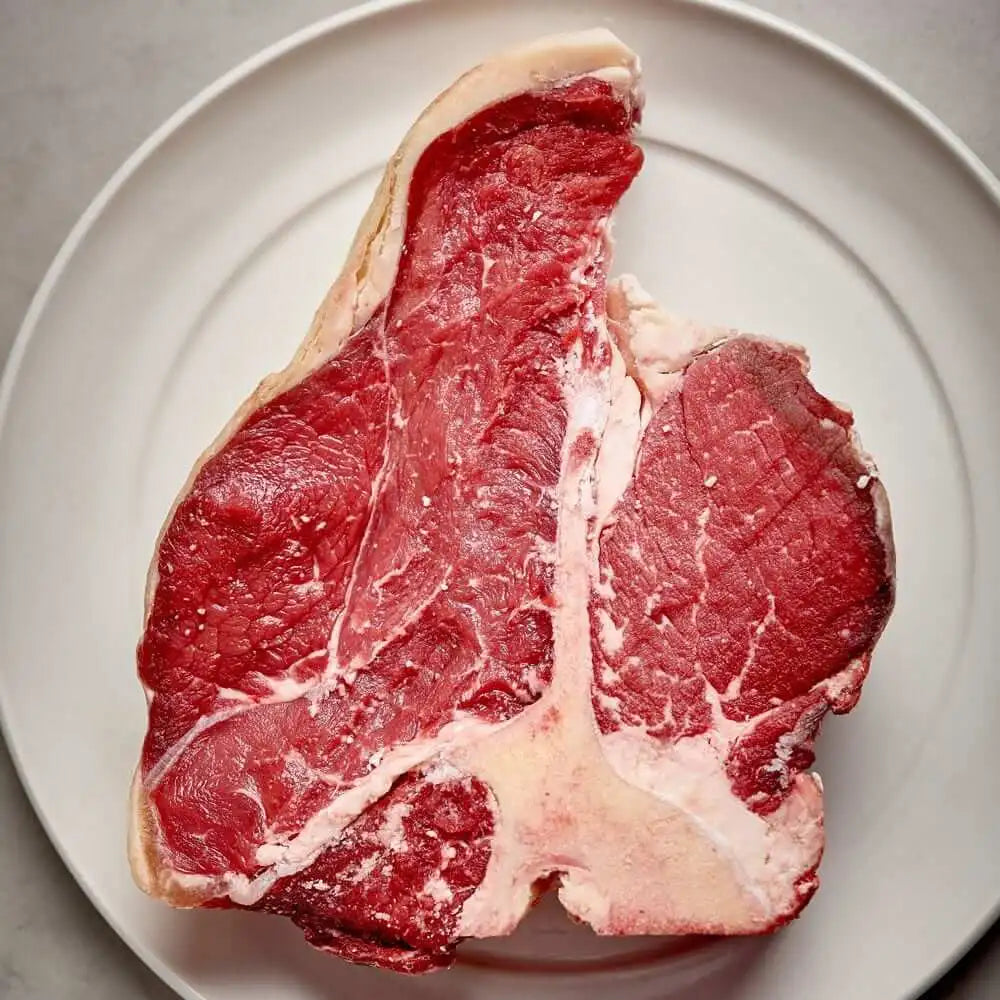 Buy-T-Bone-Steak-32oz-Online-Meat-Supermarket_jpg_26aa33f4-bcda-48e2-b7db-9b9e1bb57178.webp__PID:bc743e93-2b43-4cf6-abbd-15889c8a3a26